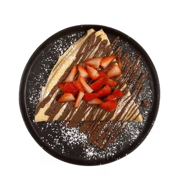 Crêpe with strawberries, chocolate sauce and icing sugar